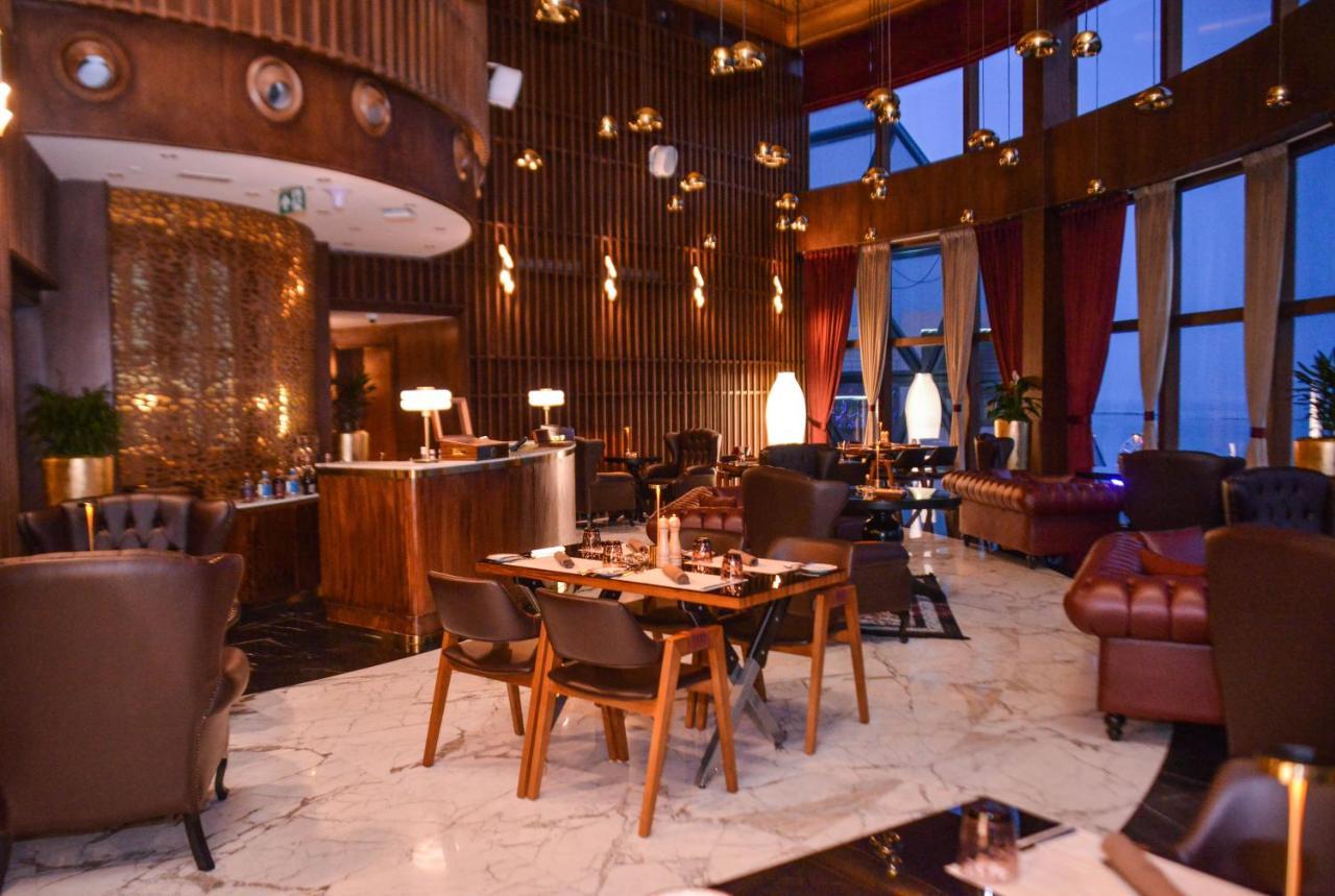 Century Marina Hotel - Lusail Esterno foto The restaurant